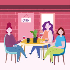 social distancing restaurant or a cafe, young women with coffee and wine cups in table, covid 19 coronavirus, new normal life