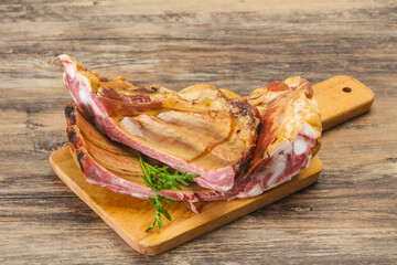 Smoked pork ribs over the wooden background