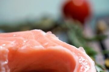 sliced salmon and tomato on a plate