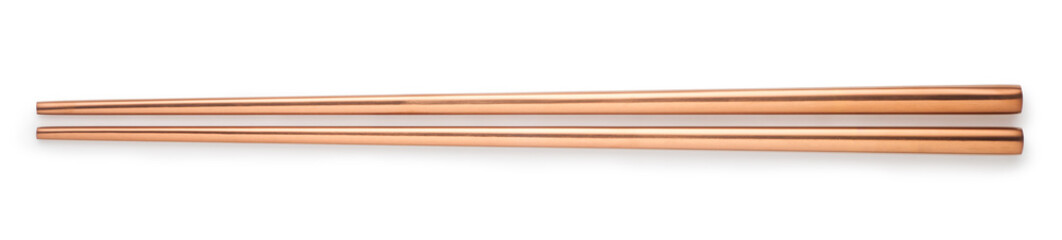 rose gold chopsticks isolated on white background. top view.