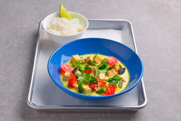 Colorful Asian meat and vegetable dish. Sweet and sour pork and mixed vegetable delicacy. Tasty dinner.