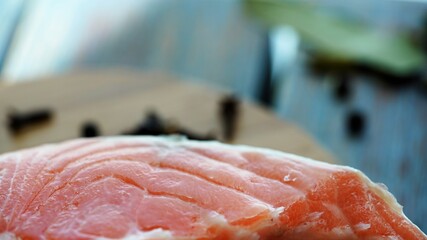 raw salmon steak on a cutting board