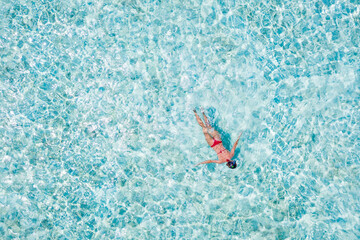 Top above high angle aerial drone view of her she girl diving pure blue clean clear ocean water pool poolside enjoying joy relax recreation spa paradise place eco calm tourism destination