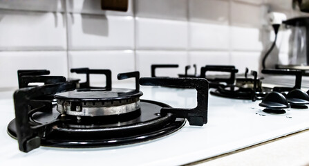 Fototapeta na wymiar Gas stove - old black metal gas cooker