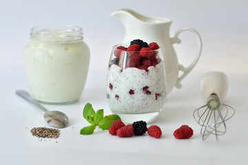 Healthy food and breakfast. glass of delicious homemade smoothie, dessert made from chia and berries. delicious milkshake, vegan raw food. Summer card. Good morning.Selective focus.