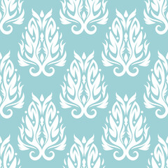 Floral seamless pattern. White on blue. Textile background
