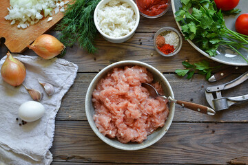 Chicken meatballs recipe. Step by step cooking meatballs in tomato sauce. Minced chicken in a bowl....