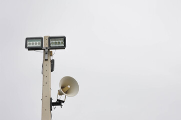 Sport light and loudspeaker strick with pillar at the car park of Asokaram temple in Samutprakarn province Thailand