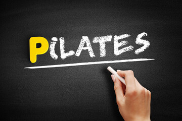 Fototapeta premium Pilates text on blackboard, concept background