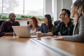 Team of businesspeople discussing work during an office meeting
