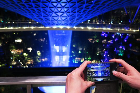 Taking Picture Of The Indoor Waterfall With Mobile Phone