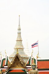 The  tower and statue in Grand Palace and national flag of Thailand in Bangkok