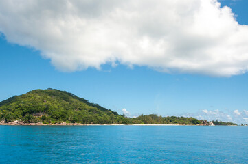 Fototapeta na wymiar Scenic view of La Digue Island with white beach and blue sky. Seychelles