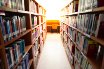 Blur image of bookshelf in the library.