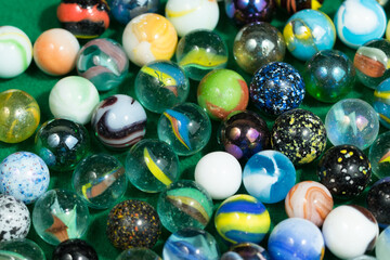 Fototapeta na wymiar Colorful Marble Balls on Green background. Abstract Pattern