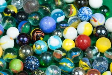 Colorful Marble Balls on Green background. Abstract Pattern