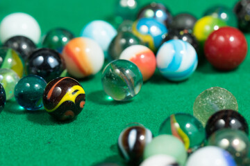 Colorful Marble Balls on Green background. Abstract Pattern