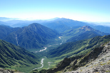Fototapeta premium the whole view of Japan alps Kamikochi from Mt. Oku-Hotakadake in summer season / 夏の上高地全景ビュー（奥穂高山頂からの南方の眺望）