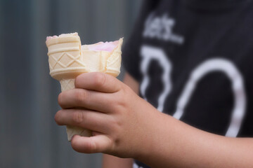 Three year old boy eating homemade ice cream.