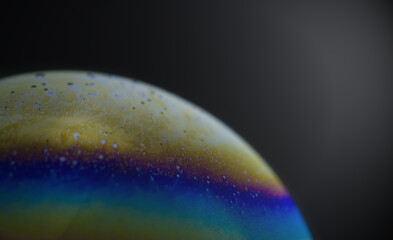 Obraz na płótnie Canvas Structure texture soap bubble abstract black background.