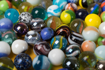 Colorful Marble Balls on Yellow background. Abstract Pattern