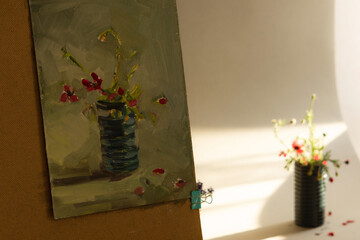 Painting still life with flowers is a step-by-step process. Step 4. Oil painting from nature. Training in oil painting. Beautiful floral still life in the artist's Studio.