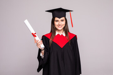 Educational theme. Graduating student girl in an academic gown. Isolated over white background.