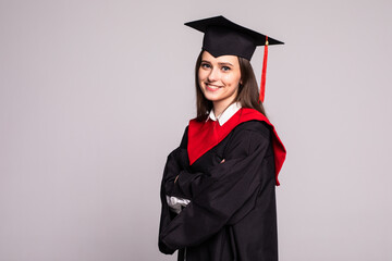 Educational theme. Graduating student girl in an academic gown. Isolated over white background.