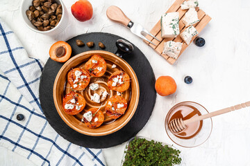 Healthy food, grilled peaches with and goat dorblue cheese, Delicious snack, Vegan food. Flat lay. Banner. Top view
