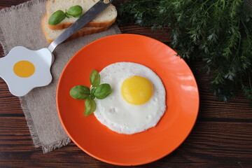 Fried chicken egg on an orange plate