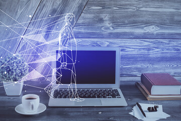 Desktop computer background in office and start up theme hologram drawing. Double exposure. Startup concept.