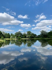 Fototapeta na wymiar Clouds reflection in the lake water, natural colors, lake background
