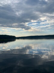 Clouds reflection in the lake water, natural colors, lake background
