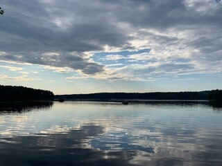 Clouds reflection in the lake water, natural colors, lake background