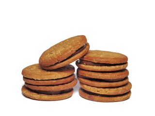Oatmeal biscuits with chocolate cream isolated on white background