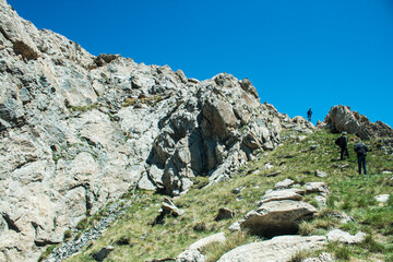 Fototapeta na wymiar travelers climb to the top of the mountain
