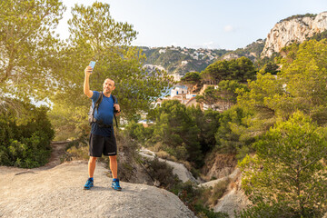 Male hiker taking a selfie