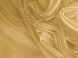 Beautiful smooth elegant wavy golden yellow satin silk. Luxury cloth fabric texture, abstract background design. Copy space. 