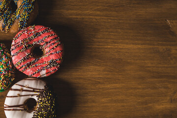 colorful donuts on a wooden table 
