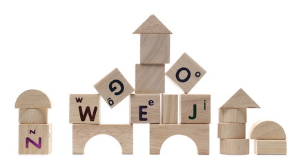 Educational wooden building blocks with alphabet letters isolated on white background