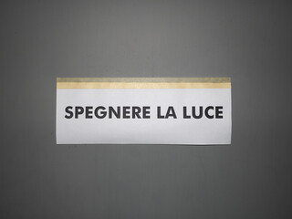 Spegnere la luce sign (translation: Turn outwall the light) sign