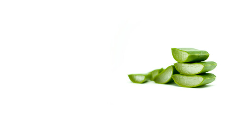 Three Stacks of Aloe Vera with Another Cuts on  the Side Fresh Natural Organic Ingredients Isolated in White Background and Place for Text on Left Side