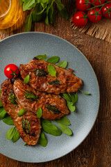 Saltimbocca. Veal schnitzel with sage and Parma ham. Italian specialty. Top view.