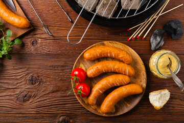 Raw, ready-to-make sausages. Grill accessories. Concept. Place for description. Top view.