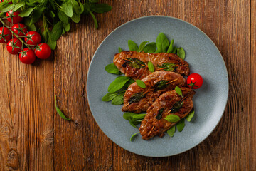Saltimbocca. Veal schnitzel with sage and Parma ham. Italian specialty. Top view.
