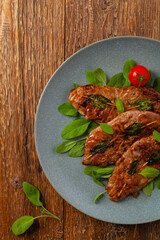 Saltimbocca. Veal schnitzel with sage and Parma ham. Italian specialty. Top view.