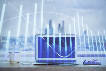 Forex Chart hologram on table with computer background. Double exposure. Concept of financial markets.