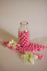 Glass bottle with pink pearl beads