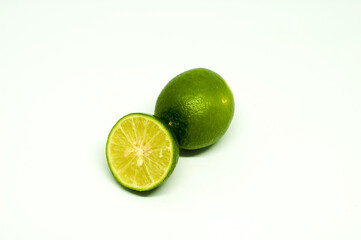 Half Fresh Lime with One Behind Isolated in White Background
