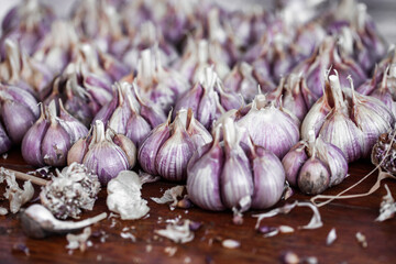 Organic garlic on wood background. Fresh herbs and spices. 